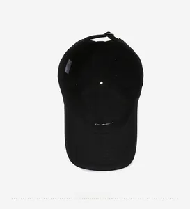 Detail showing 100% cotton inner lining and adjustable metal buckle of the black baseball cap