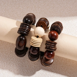 Vintage geometric wooden bead bracelets with coconut shell charms in warm earth tones
