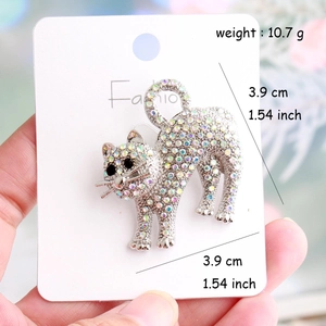 Detail of cute cat brooch with iridescent rhinestones and 1.54 inch size measurement