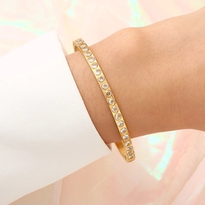 18K gold plated stainless steel hinge bangle with sparkling zircon stones on wrist