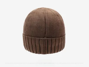 Detail view of the back of a thick ribbed knit beanie in dark coffee brown color