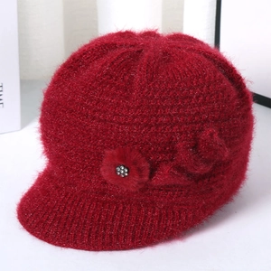 Detail of wine red winter knit hat for elderly women featuring rhinestone flower accent