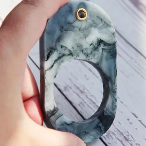 Customizable oval resin pendant with marble texture and gold hanging hole for DIY photos