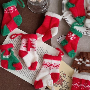 Knitted Christmas stocking ornaments set in festive red, green and white colors