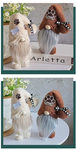 Close-up of plush dog gnomes with bone appliqués and woof embroidery detail