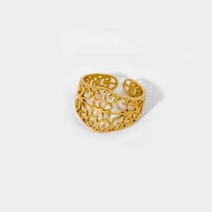 Detailed close-up of a 18K gold-plated stainless steel ring with hollow vintage patterns