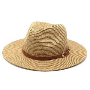 Classic straw sun hat in khaki with brown leather band and gold buckle on white background