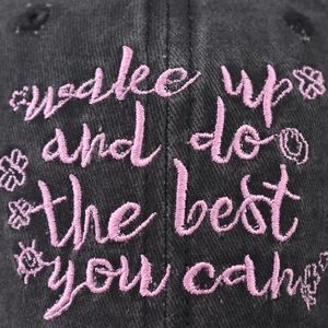 Washed black cotton baseball cap with pink embroidered quote and sun flower patterns