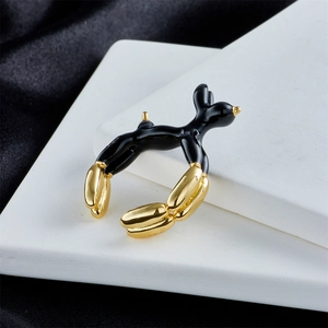 Detailed macro view of an 18K gold-plated black enamel balloon dog open ring
