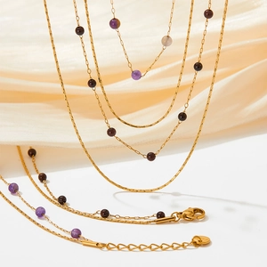 Gold layered stainless steel necklace with natural purple and brown stone beads on silk