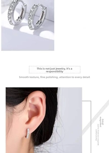 Close-up of S925 silver hoop earrings with white zircon pavé setting and worn on the ear