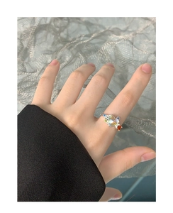 Close-up of S925 silver ring featuring rainbow moonstone and colorful zircon accents