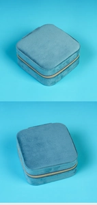 Detail of the sky blue velvet jewelry box showing a high-quality metal zipper closure