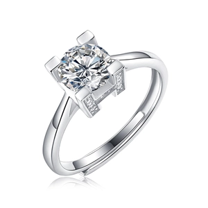 Macro side view of silver ring showing H-shaped hollow setting and round brilliant cut stone