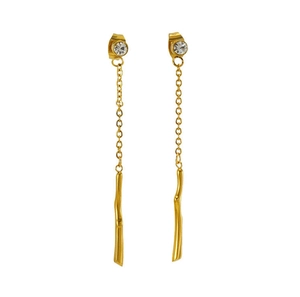 Detail of gold tassel earrings featuring clear crystal studs and slim metallic bar pendants