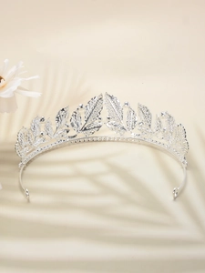 Detail of silver leaf bridal tiara with rhinestones and elegant palm leaf shadows