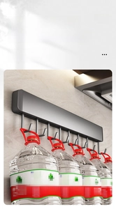Close-up of wall-mounted dark grey 8-hook rack showing heavy duty weight capacity