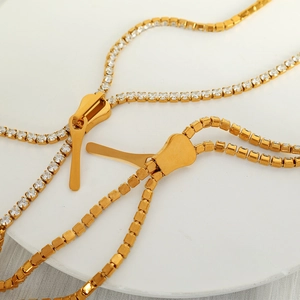 Minimalist gold-plated zipper pendant necklace with sparkling white rhinestones inlay