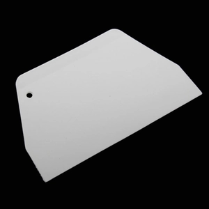 White trapezoid plastic scraper tool for baking dough cutting and DIY wall putty smoothing