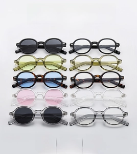 Flat lay of retro oval sunglasses collection in various colors with acetate frames