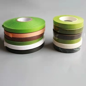 Macro view of multi-color floral tape rolls for flower stem wrapping and DIY crafts