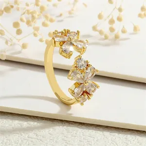 Macro detail of adjustable maple leaf ring featuring pear-cut zircon floral crystals