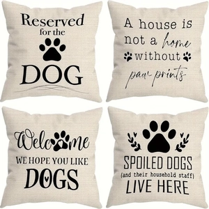 Set of four linen pillowcases with black dog-themed prints and paw patterns