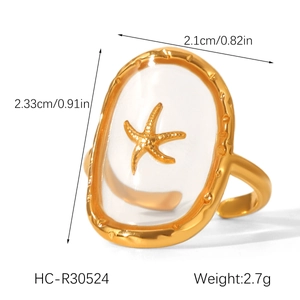 Detail view of adjustable gold starfish ring with dimensions and 2.7g weight info