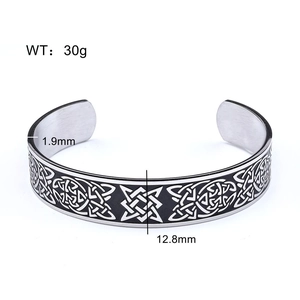 Detail showing 12.8mm wide vintage stainless steel cuff with Celtic knot engraving