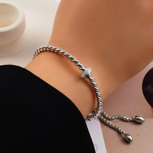 Macro detail of vintage twist bracelet with sparkling zircon buckle and adjustable closure