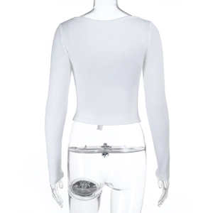 Back view of a white lace long sleeve cropped top featuring delicate bow details