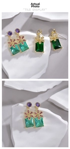 Detail showing elegant long drop earrings with flower studs and rectangular gemstones