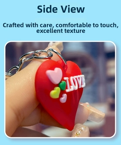 Detailed view of red heart PVC keychain with 3D LOVE text and colorful heart accents