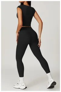 Detail showing high-waisted slimming black fitness leggings and supportive sport top