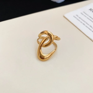 Close-up of gold starfish irregular geometric ring with modern streamlined metallic design