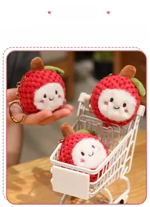Close-up of cute plush lychee keychains with soft textures and sweet expressions