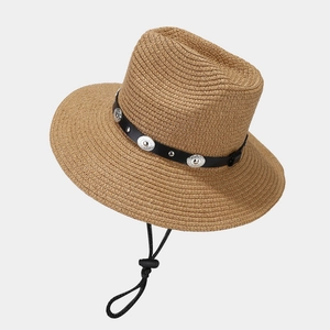 Wide brim straw sun hat with leather band and metal buckle on light gray background