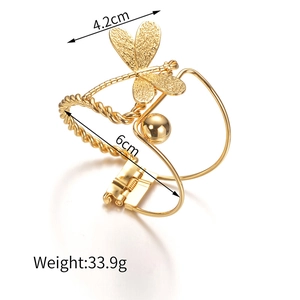 Detail view of 18K gold plated dragonfly bangle with dimensions 4.2cm by 6cm