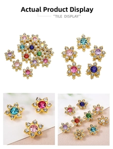 Detail shot of 13mm rhinestone flower charms with colorful crystals and gold base