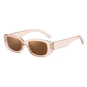 Modern square sunglasses with transparent pink frame and gradient brown lenses