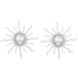 Detail shot of silver sun-shaped stud earrings with polished rays on white background