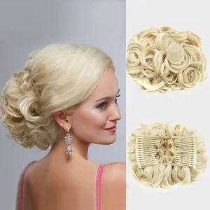 Detail view of light blonde curly hair bun extension with secure inner comb attachment