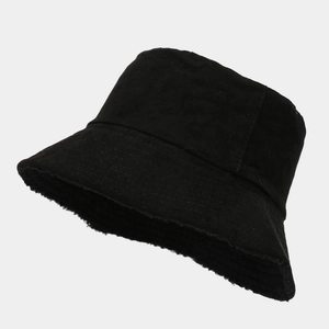 Detail view of black velvet bucket hat showing high-quality fabric and wide brim structure