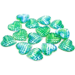 Macro detail of 16mm heart-shaped resin scales with green and blue gradient shine