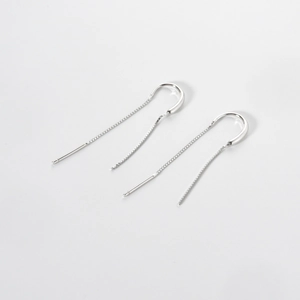 Close-up of S925 sterling silver tassel drop earrings with sleek long chain design