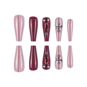 Deep burgundy and dusty pink coffin press-on nails with 3D cross crystals and gold dots