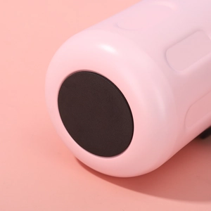 Detail view of pink insulated tumbler with a black non-slip rubber bottom pad