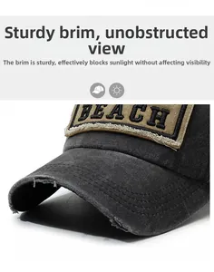 Dettaglio del cappellino grigio lavato con ricamo BEACH e visiera effetto consumato