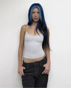Detail of light blue U-neck cropped tank top showing fit and elastic fabric texture