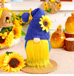 Close-up of a sunflower gnome plush with a blue knitted hat and yellow beard on burlap